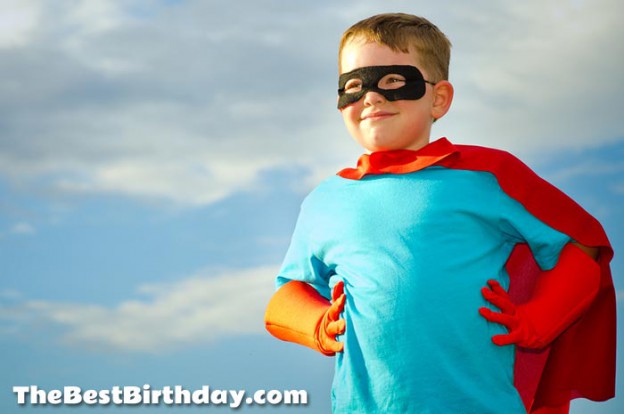 Young superhero child pretending to be superman for a party